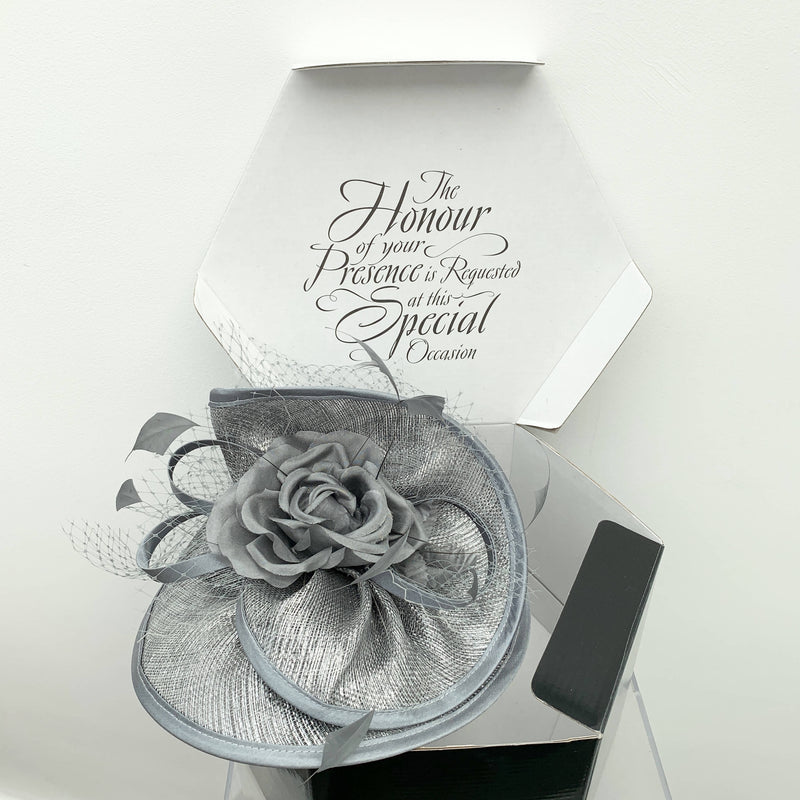 Vintage grey cocktail hat with decorative flower and net by Stephen Jones
