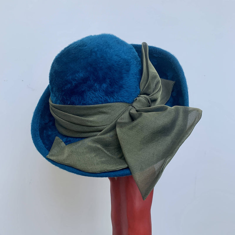 Blue oversized statement vintage felt hat with upturn brim and green bow