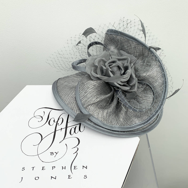 Vintage grey cocktail hat with decorative flower and net by Stephen Jones