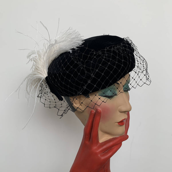 Vintage black velvet pillbox hat with net veils white feathers made in UK